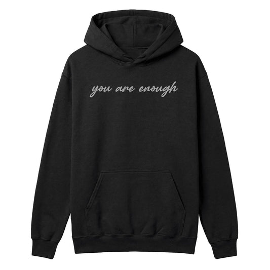 Black hoodie with grey “You Are Enough” script across the front