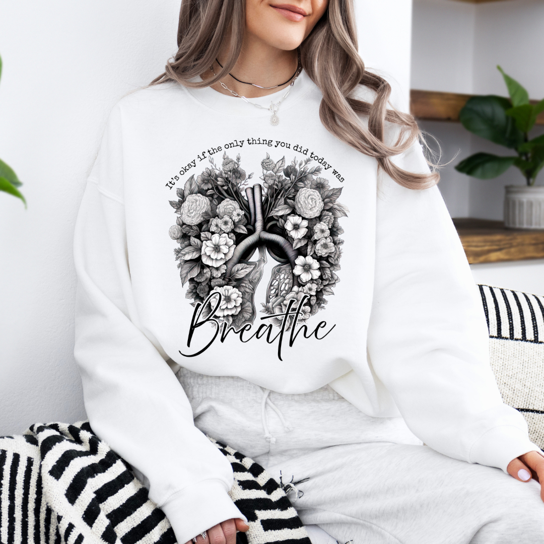 white breathe crewneck sweatshirt with floral lung design