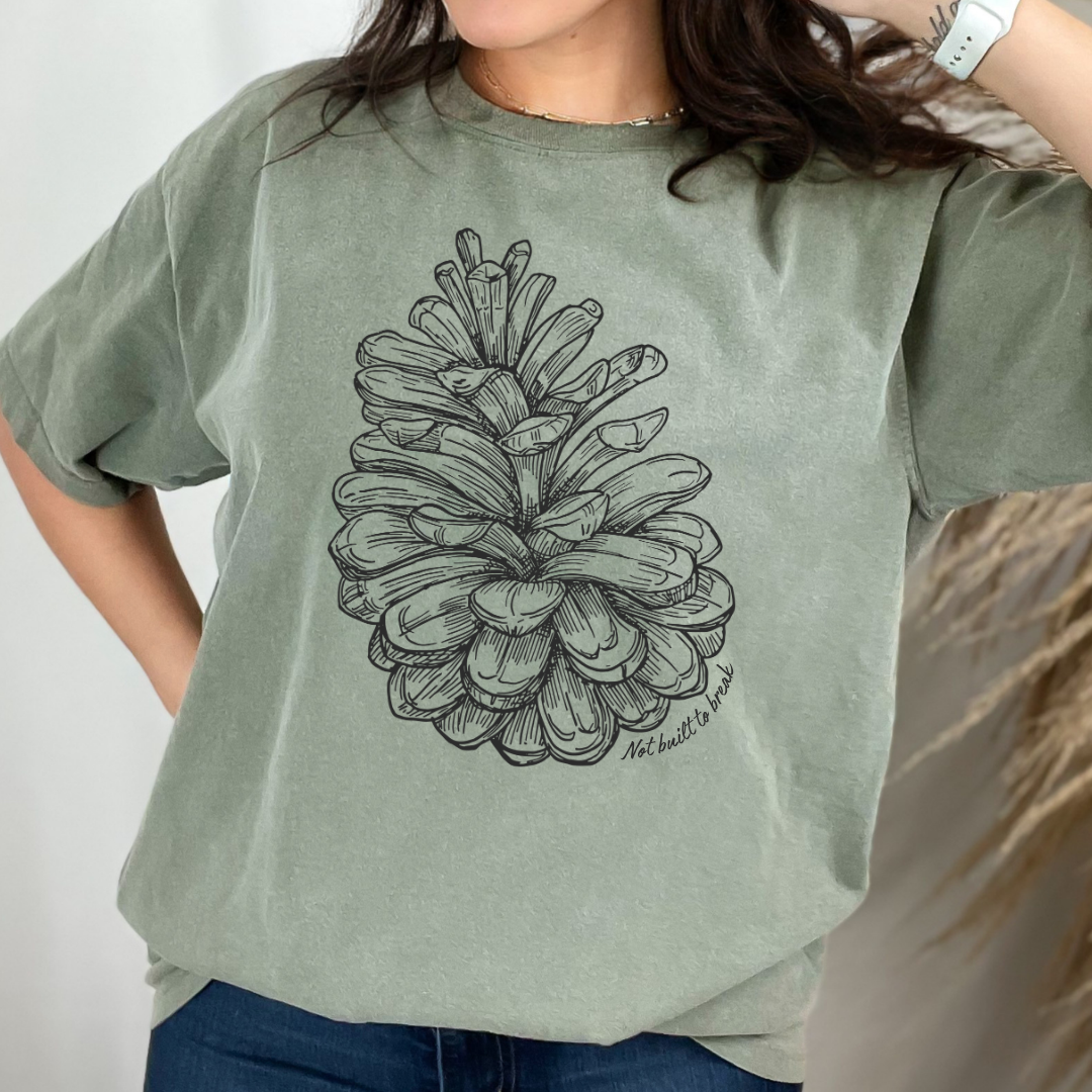 bay not built to break t shirt with pinecone design