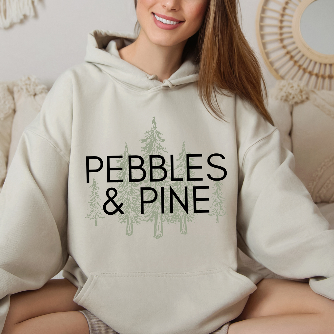 sand Pebbles & Pine hoodie with pine tree logo design on front