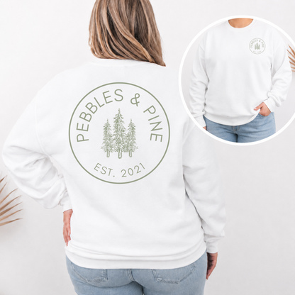 white Pebbles & Pine crewneck with green Est. 2021 pine tree logo on back and front chest design