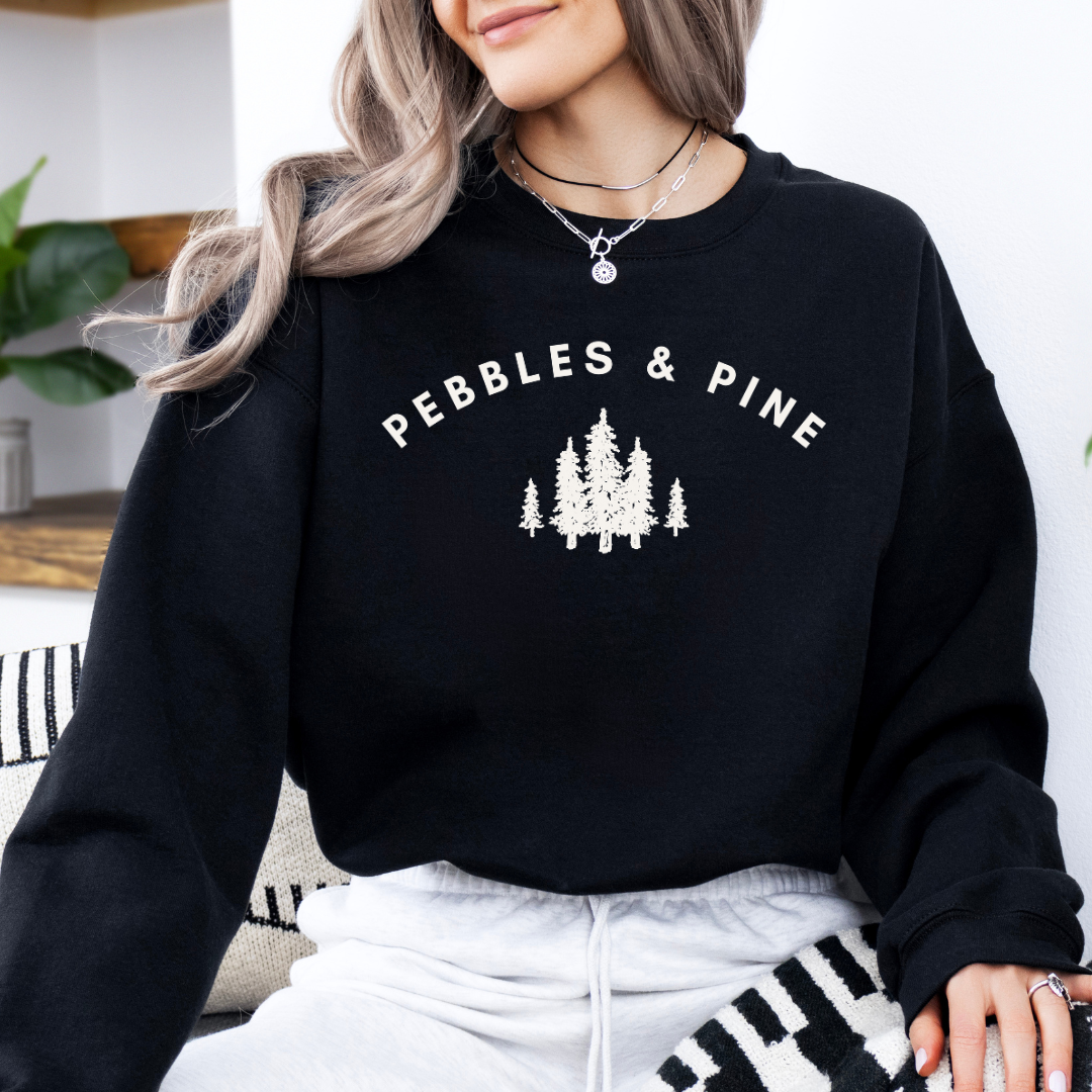 black Pebbles & Pine crewneck sweater with white pine tree logo design on front