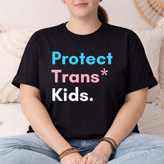 person wearing black protect trans kids pride shirt with bold text design