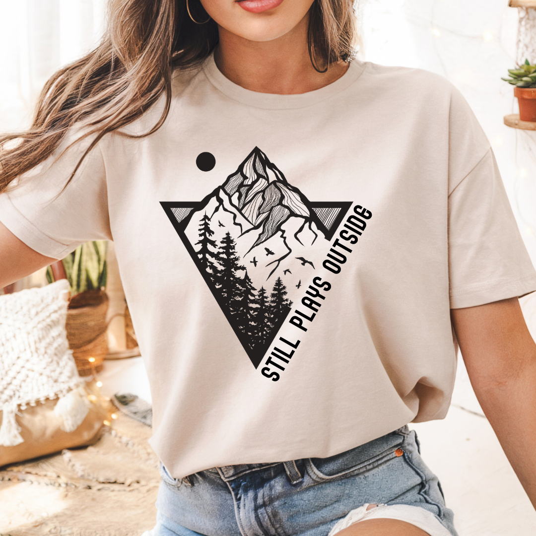 sand still plays outside t shirt with mountain and forest graphic design