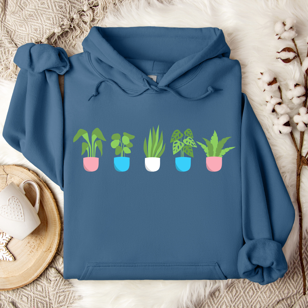 indigo blue trans plant pots hoodie with potted plants in trans flag colours across chest