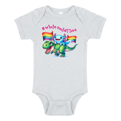 White baby bodysuit with cartoon axolotl riding a dinosaur, rainbow pride flags and “A Whole Axolotl Love” text