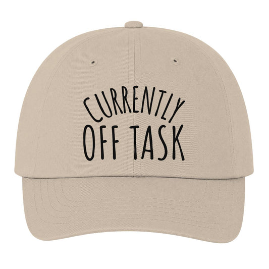 A beige baseball cap with 'CURRENTLY OFF TASK' embroidered in black on the front, shown against a plain white background.