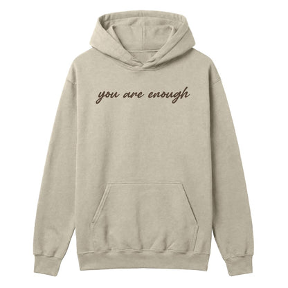 Sand hoodie with “you are enough” script printed across the front