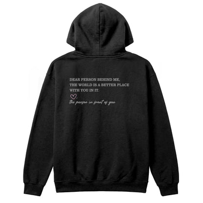Back of black hoodie with “Dear Person Behind Me, the World Is a Better Place With You in It” message