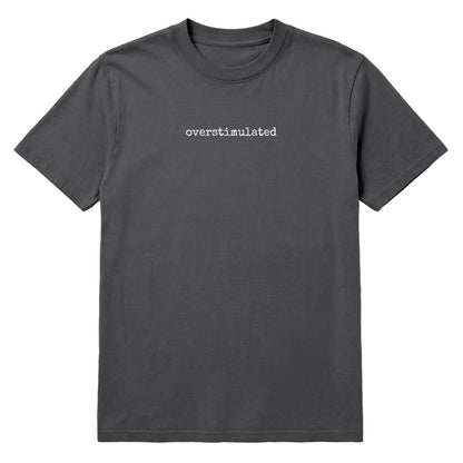 Pepper grey T-shirt with small white “Overstimulated” text across the chest