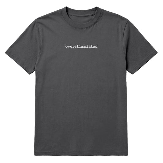 Pepper grey T-shirt with small white “Overstimulated” text across the chest