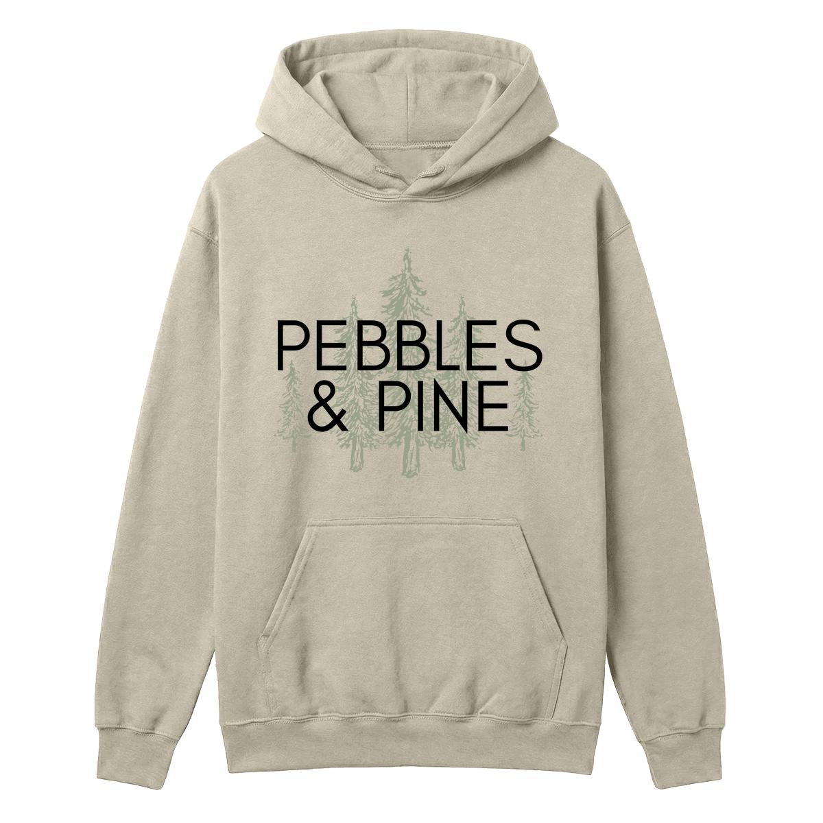 Sand hoodie with Pebbles & Pine text over a pine tree graphic on the front