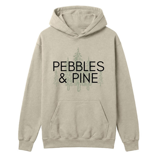 Sand hoodie with Pebbles & Pine text over a pine tree graphic on the front