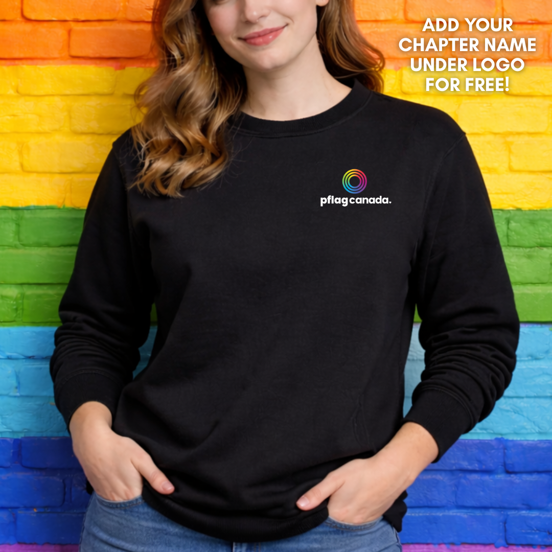 person wearing black pflag Canada crewneck with small logo design