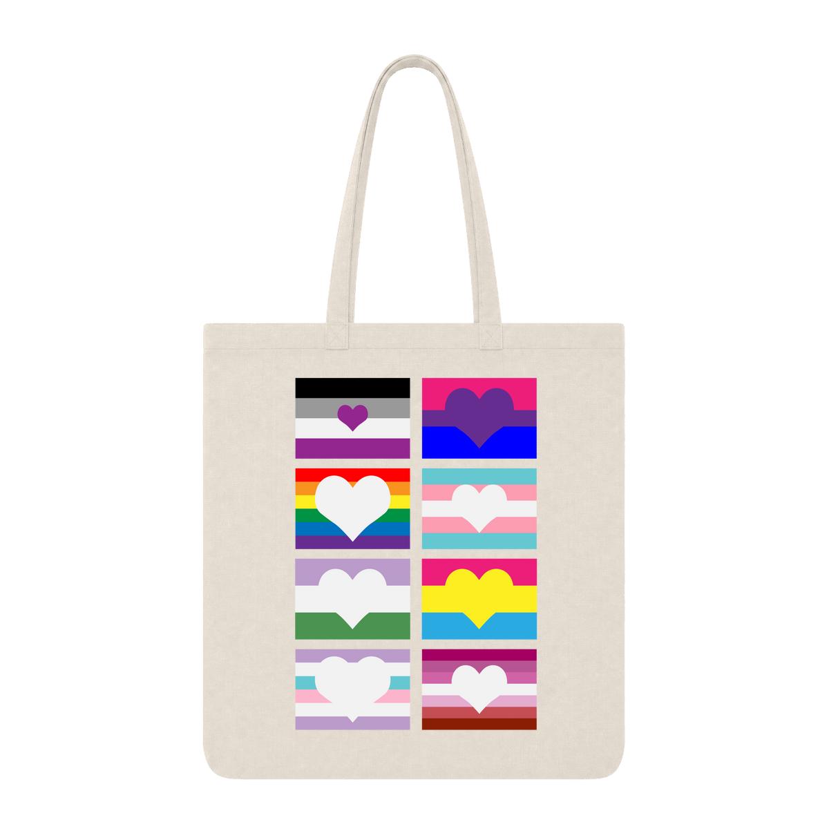 Natural tote bag with eight LGBTQ+ pride flag graphics featuring heart shapes