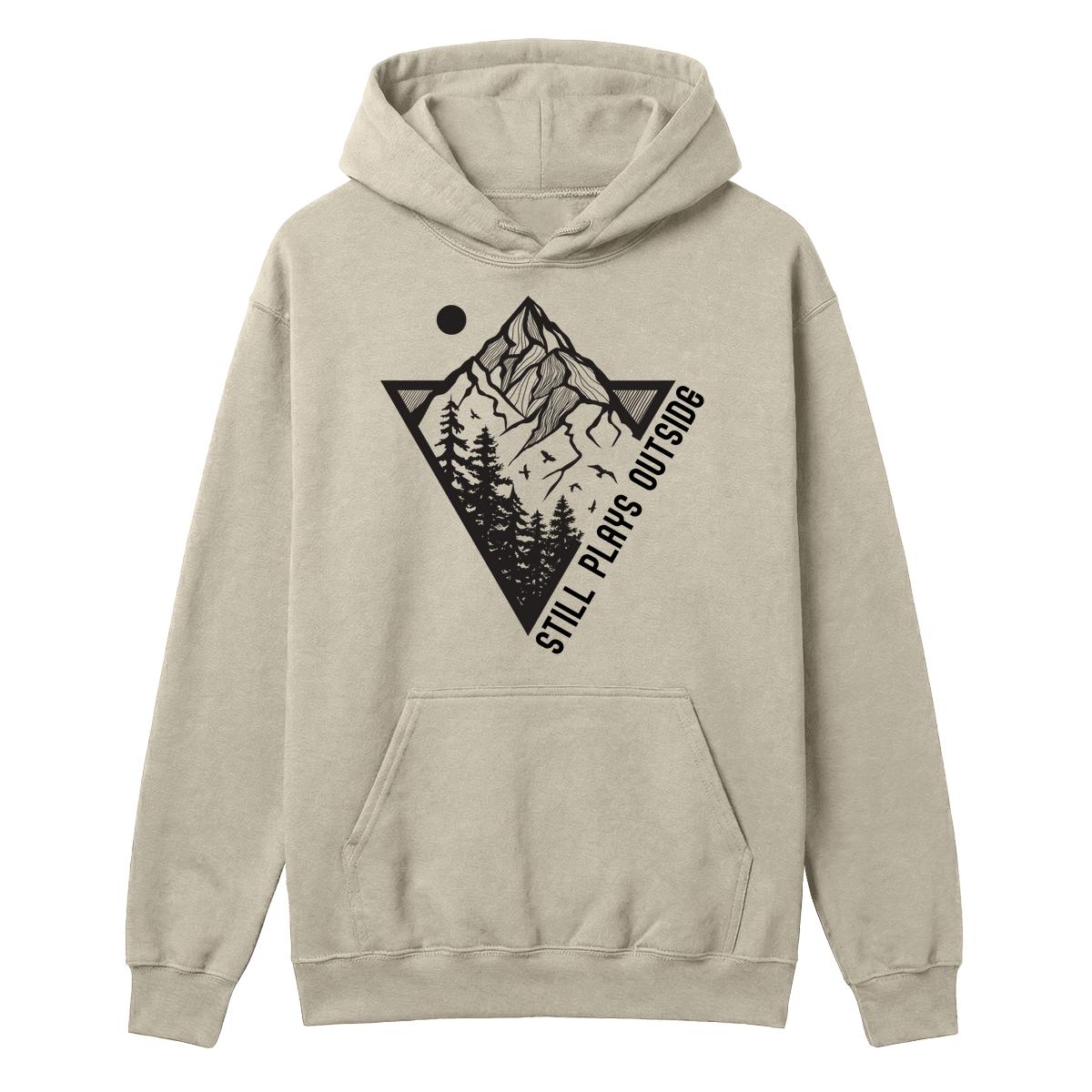 Sand hoodie with mountain and pine tree graphic and “Still Plays Outside” text