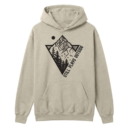 Sand hoodie with mountain and pine tree graphic and “Still Plays Outside” text