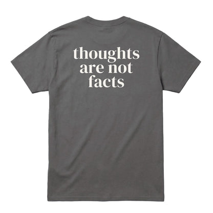 Back of charcoal T-shirt with large “Thoughts Are Not Facts” text