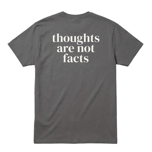 Back of charcoal T-shirt with large “Thoughts Are Not Facts” text