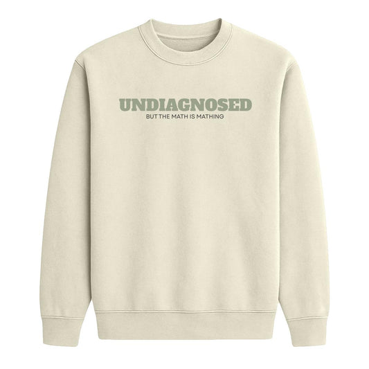 Sand crewneck sweatshirt with “Undiagnosed But the Math Is Mathing” text in sage green and black