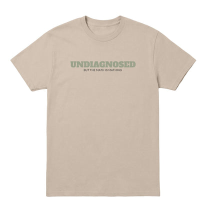 Sand T-shirt with “Undiagnosed But the Math Is Mathing” text in sage green and black