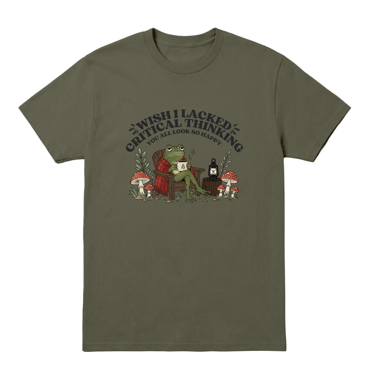 A military green short-sleeve crewneck t-shirt featuring a graphic print of a green frog sitting in a red plaid chair, surrounded by mushrooms, with the text 'WISH I LACKED CRITICAL THINKING SO ALL LOOK SO HAPPY' arched above it.
